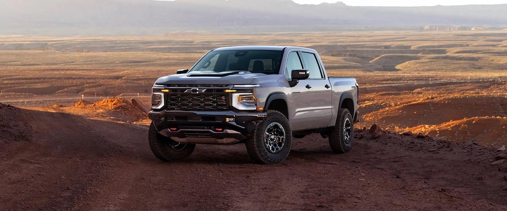 A gray 2027 Chevrolet Silverado truck parked in the desert