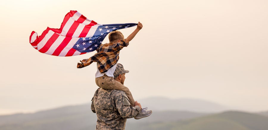 Military with kid and flag